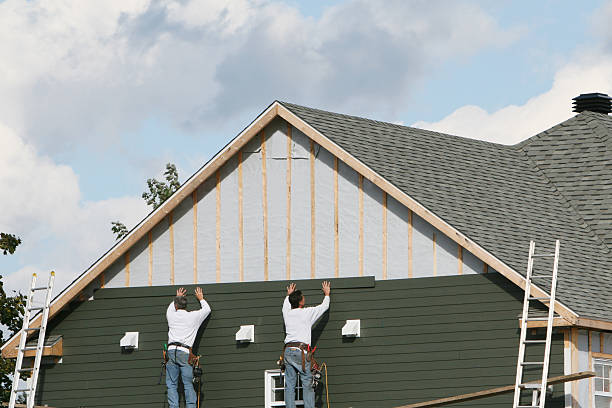 Professional Storm Damage Siding Repair technician working in Lexington, TX